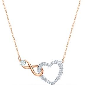 Swarovski necklace with a diamond heart and infinity sign with a diamond on it